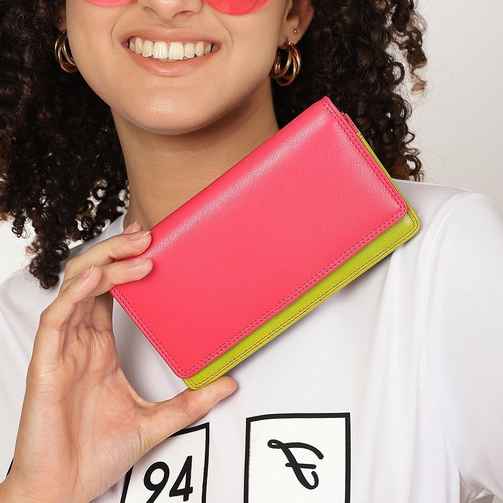 Person holding a two-tone leather wallet with a pink top and green bottom.