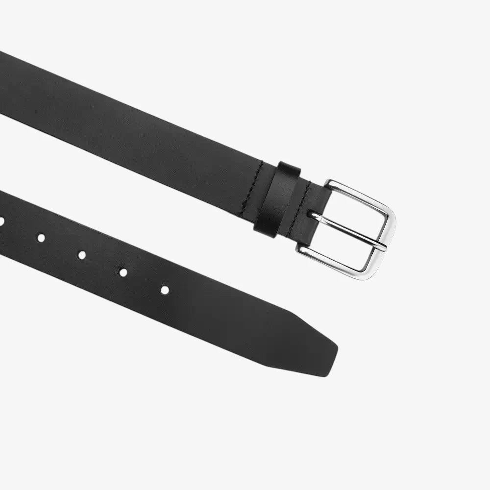 Top angle view of Black belt with a silver buckle on a white background