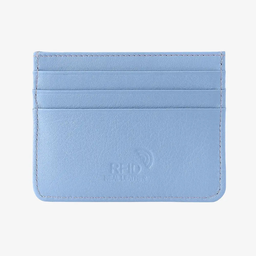 A pastel blue leather card holder wallet with four card slots and a debossed logo on the front, shown on a plain light gray background.