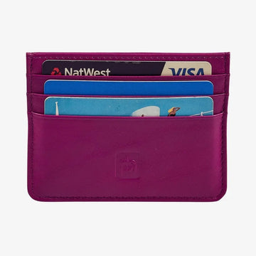 A fuchsia leather card holder wallet with multiple card slots containing sample credit cards, shown against a light gray background.