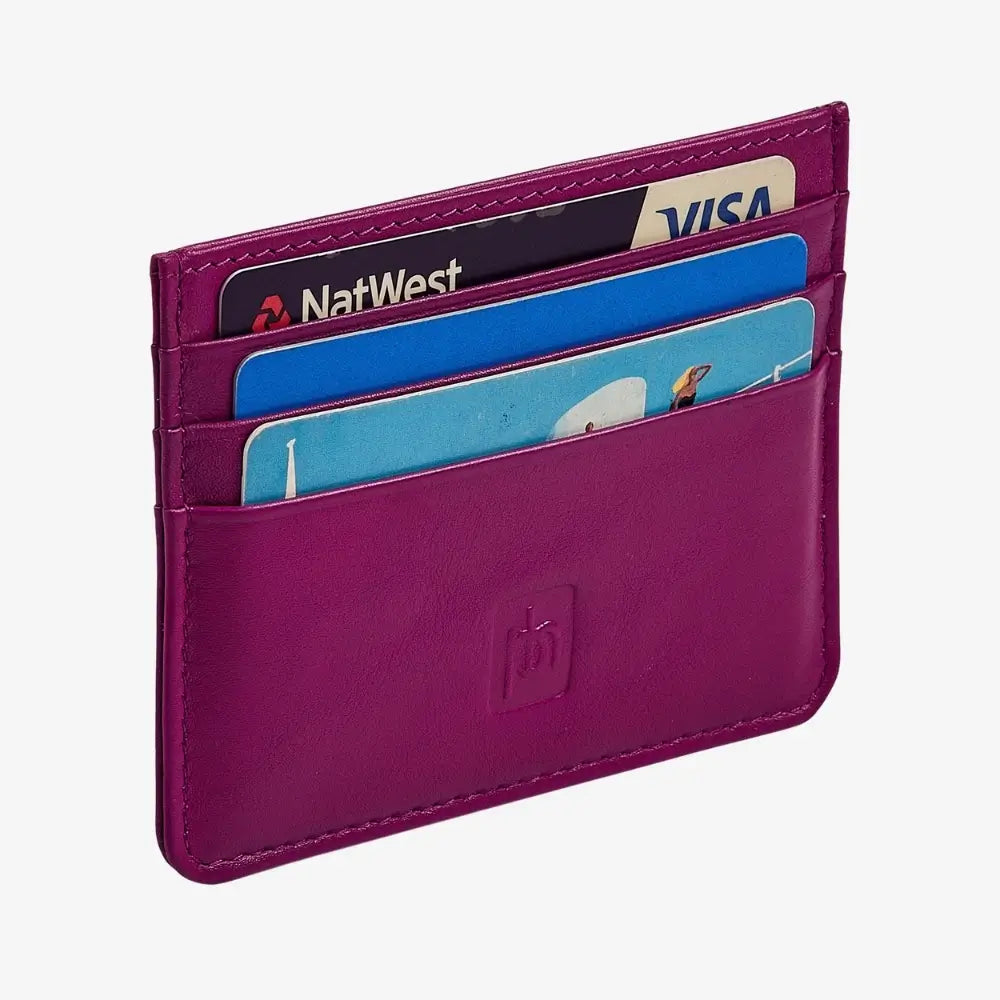 A fuchsia leather cardholder wallet with multiple card slots containing credit cards, shown on a light gray background.