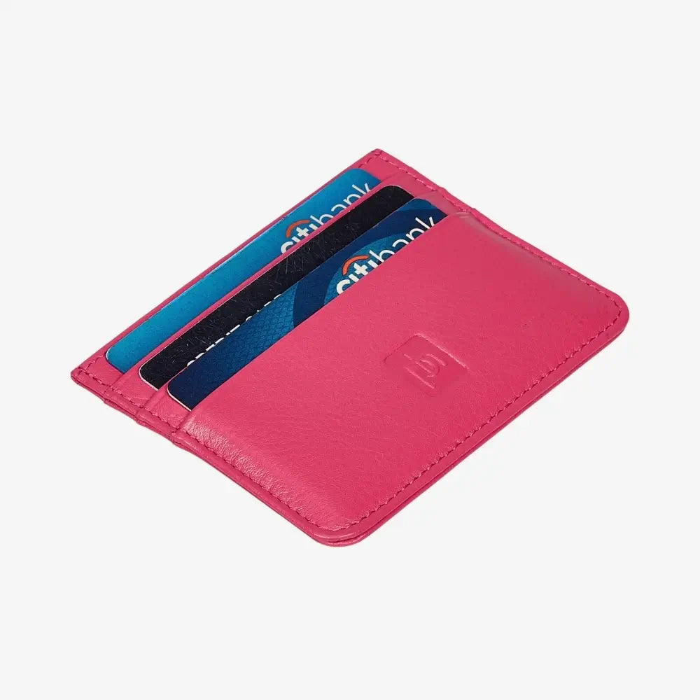 A pink leather cardholder wallet shown open, containing three blue and black cards, on a light gray background.
