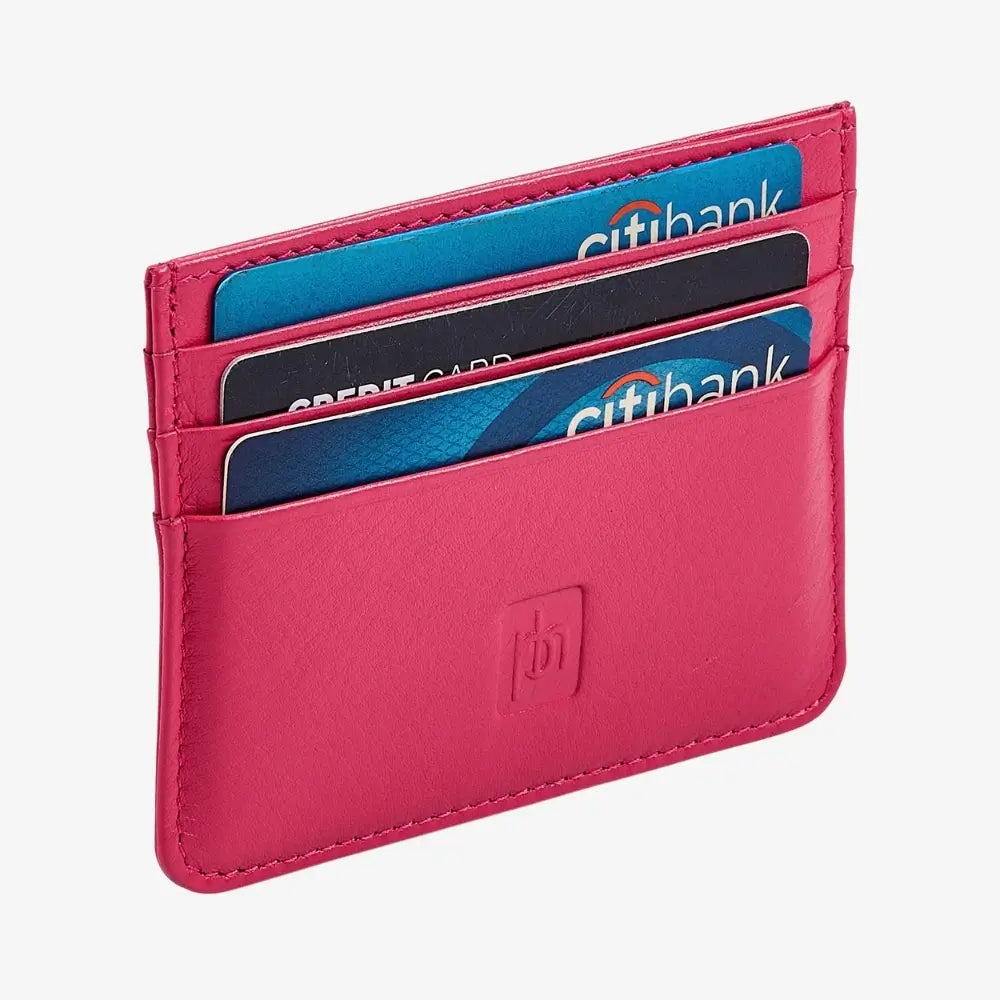 Side angle view of pink leather card older with multiple card holders inside it.