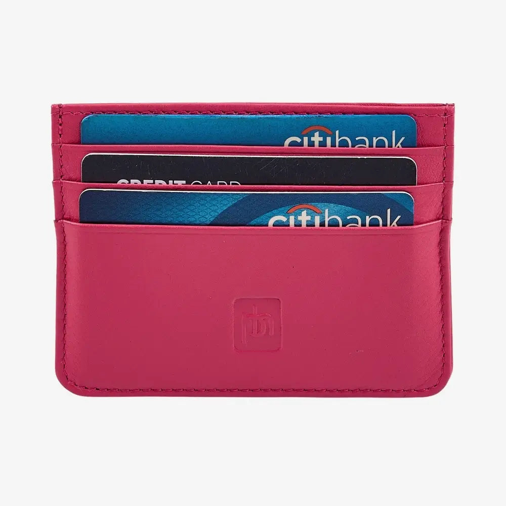 A pink leather card holder wallet with four slots containing credit cards, shown against a plain white background.