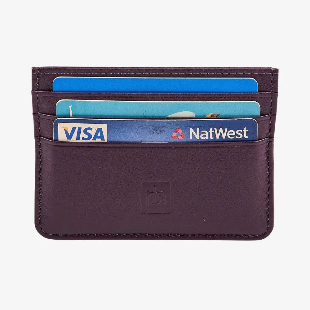 A purple leather cardholder wallet with multiple cards inserted, including Visa and NatWest cards, shown against a plain white background.