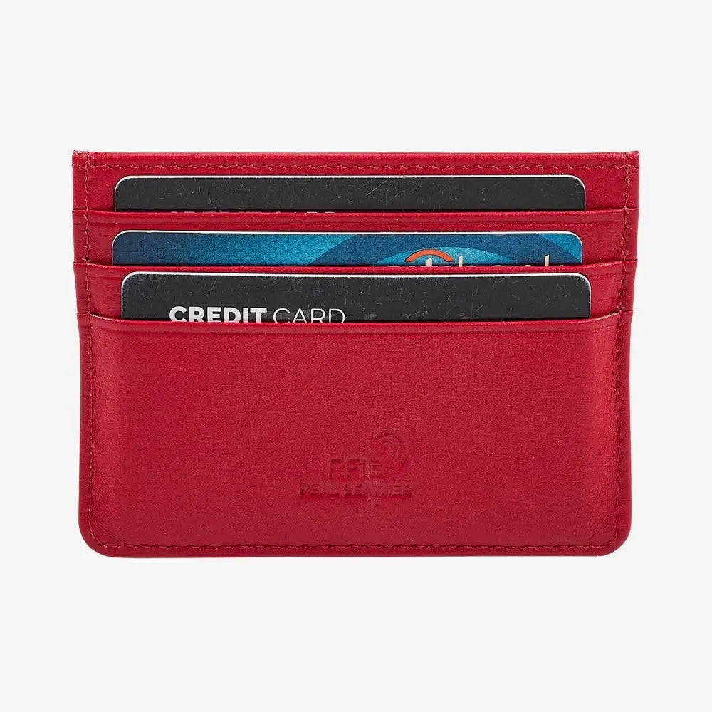 A red leather card holder wallet with multiple card slots containing sample credit cards, shown against a plain white background. The brand name 'FELINE LEATHER' is debossed on the front.