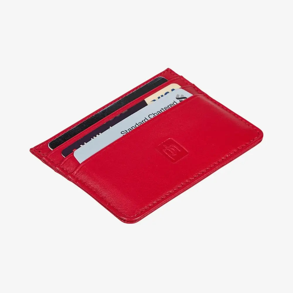 A red leather cardholder wallet shown open, containing several cards, on a light gray background.