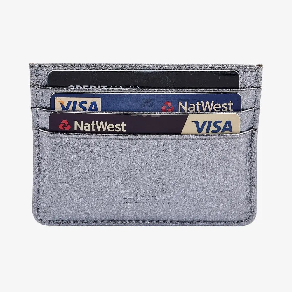 Front view of sliver leather card holder on agrey background.