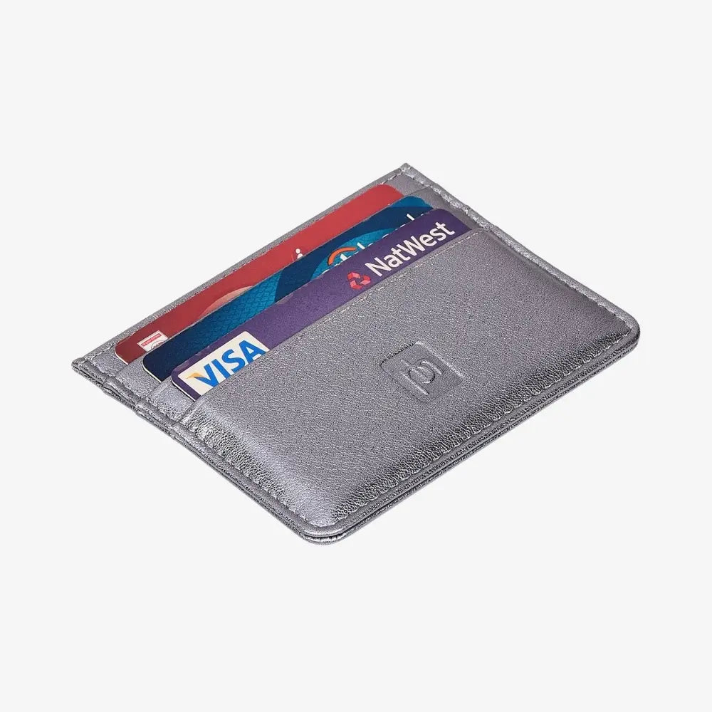 A slim metallic silver cardholder wallet with three cards partially inserted, featuring a debossed logo on the front, shown on a light gray background.