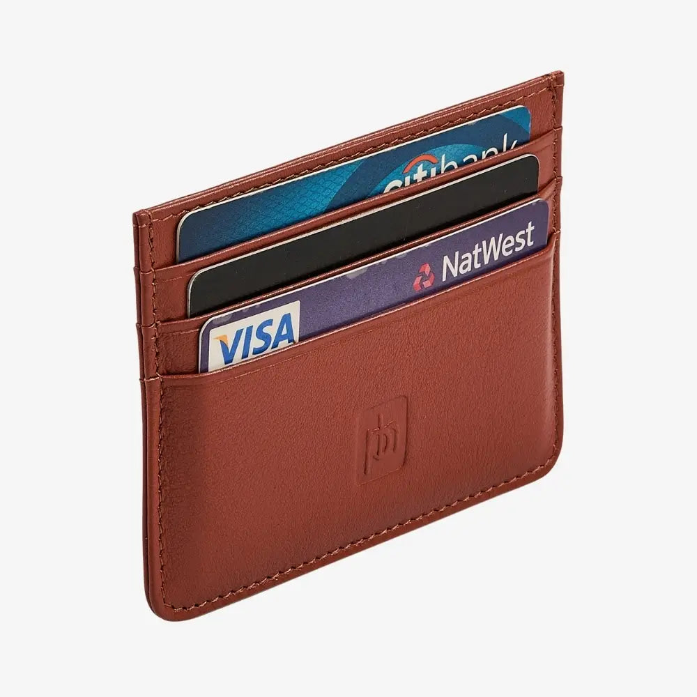 Side angle view of tan leather on a grey background.