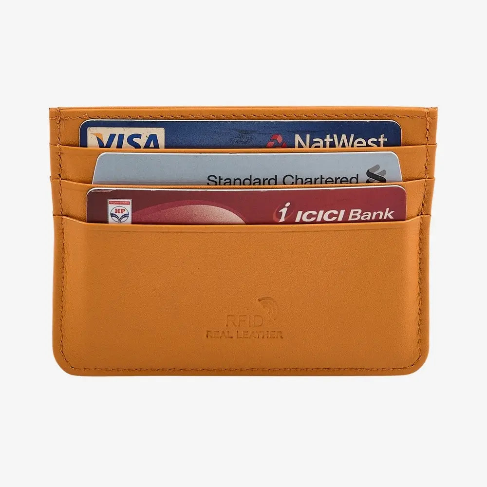 A yellow leather cardholder wallet with four credit cards inserted, featuring an embossed 'RFID REAL LEATHER' logo on the front, set against a plain light gray background.