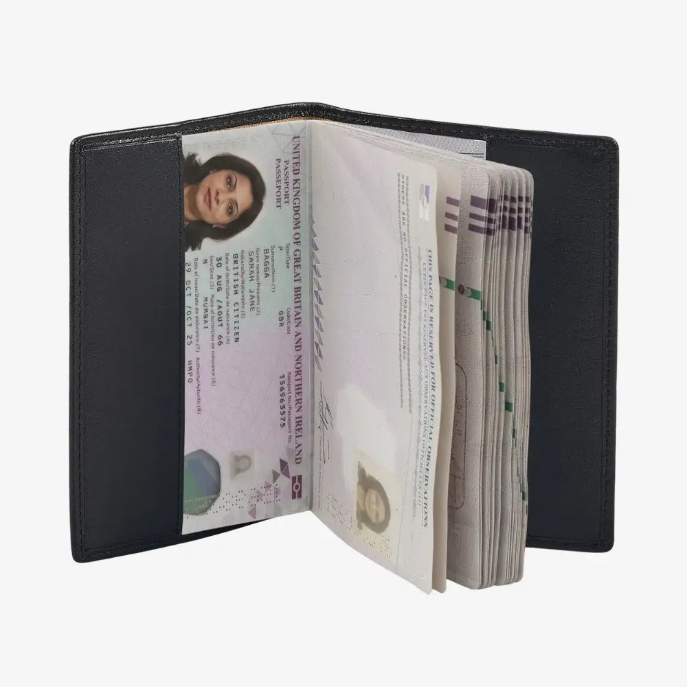 A black leather passport holder shown open, displaying multiple passport pages and a stack of cash in the side pockets, set against a plain white background.