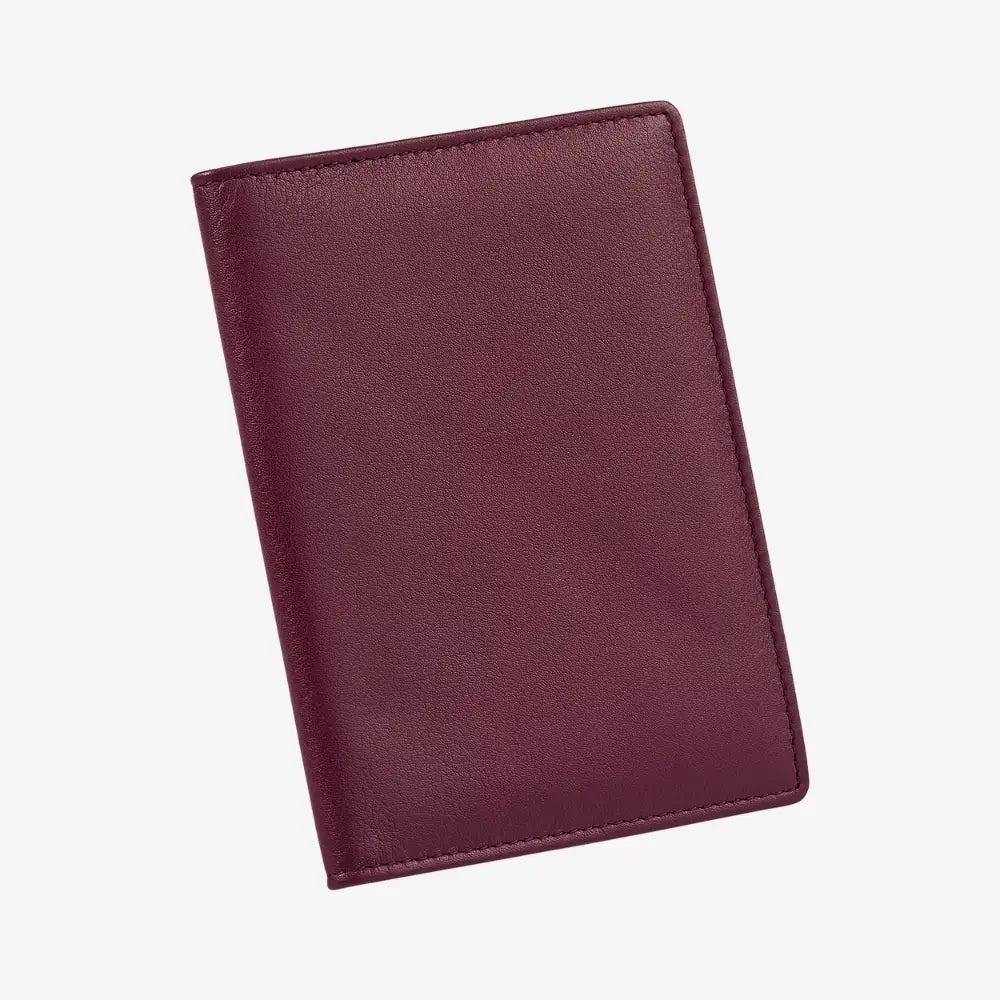 A burgundy leather passport cover shown closed at an angle on a plain white background.
