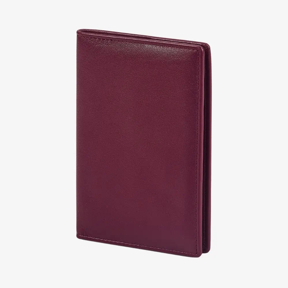 A burgundy leather passport cover standing upright against a plain white background.