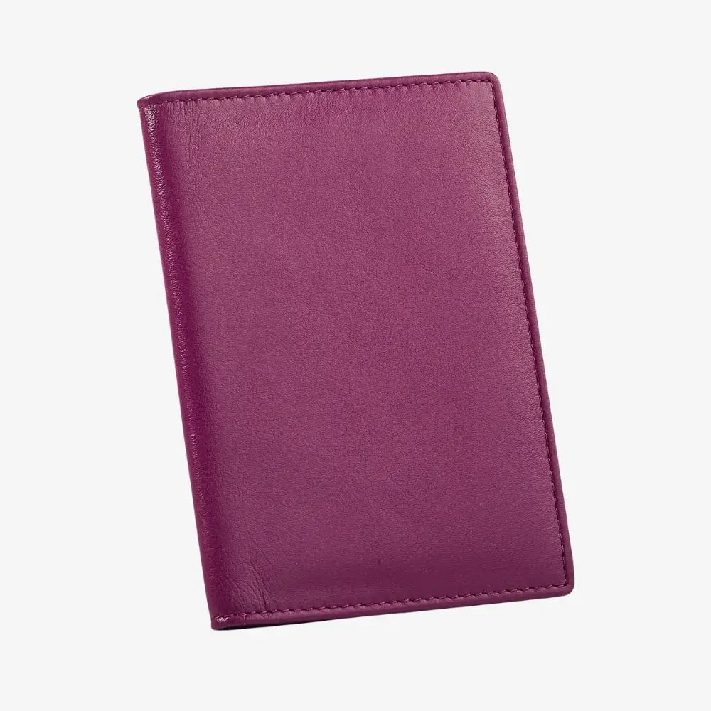 A fuchsia leather passport cover shown closed at an angle on a light gray background.