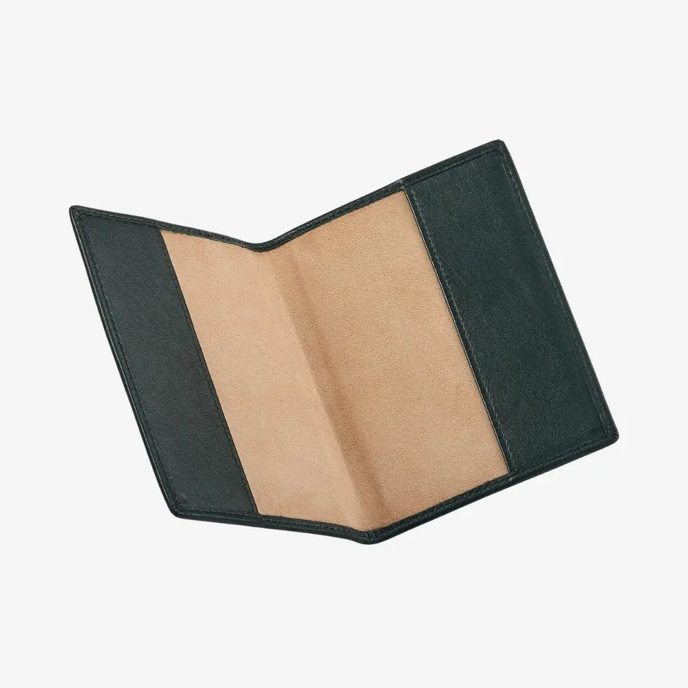 An open green leather passport holder, showing a tan interior, photographed on a light gray background.