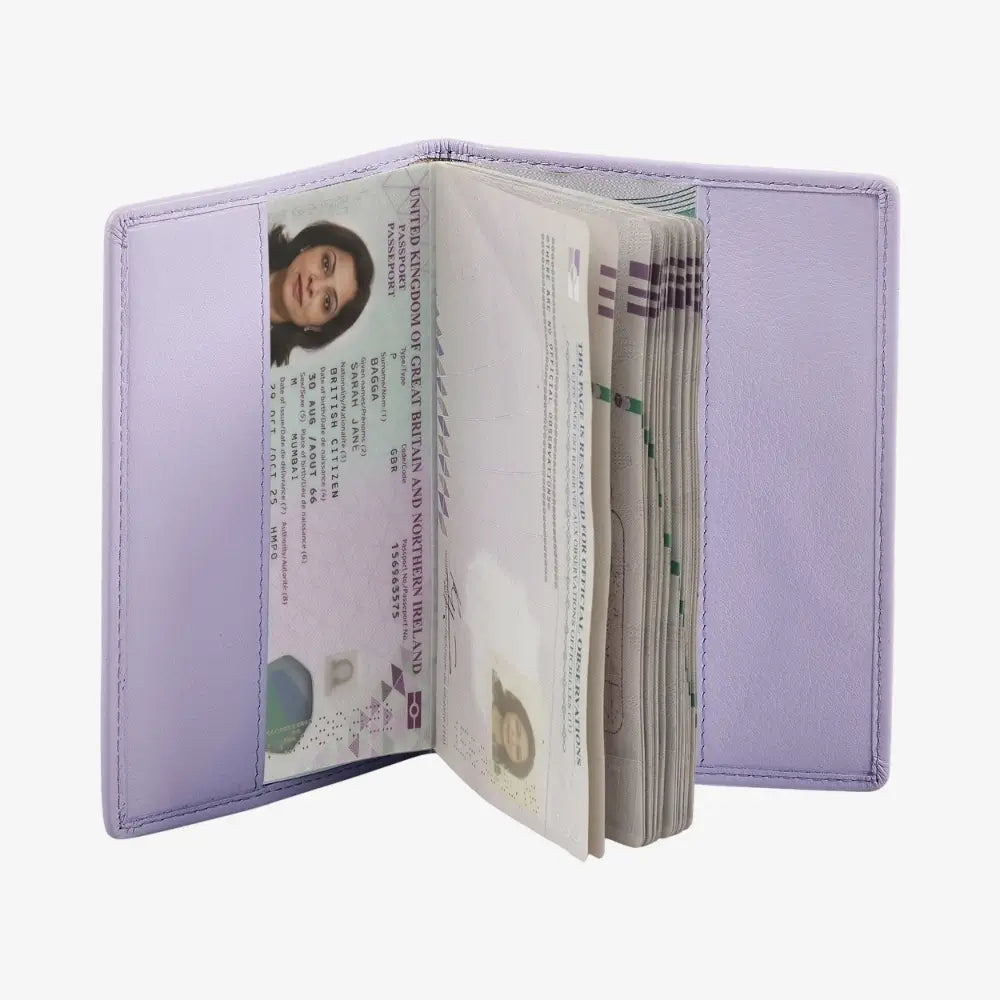 A lilac leather passport holder shown open, displaying its interior compartments with a passport and cash inside, set against a plain white background.