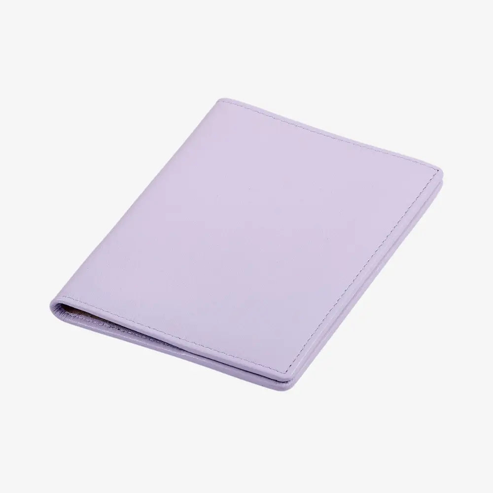 A lilac leather wallet shown closed at an angle on a clean white background.