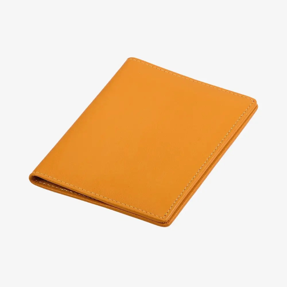 A yellow leather passport holder shown closed at an angle on a clean white background.