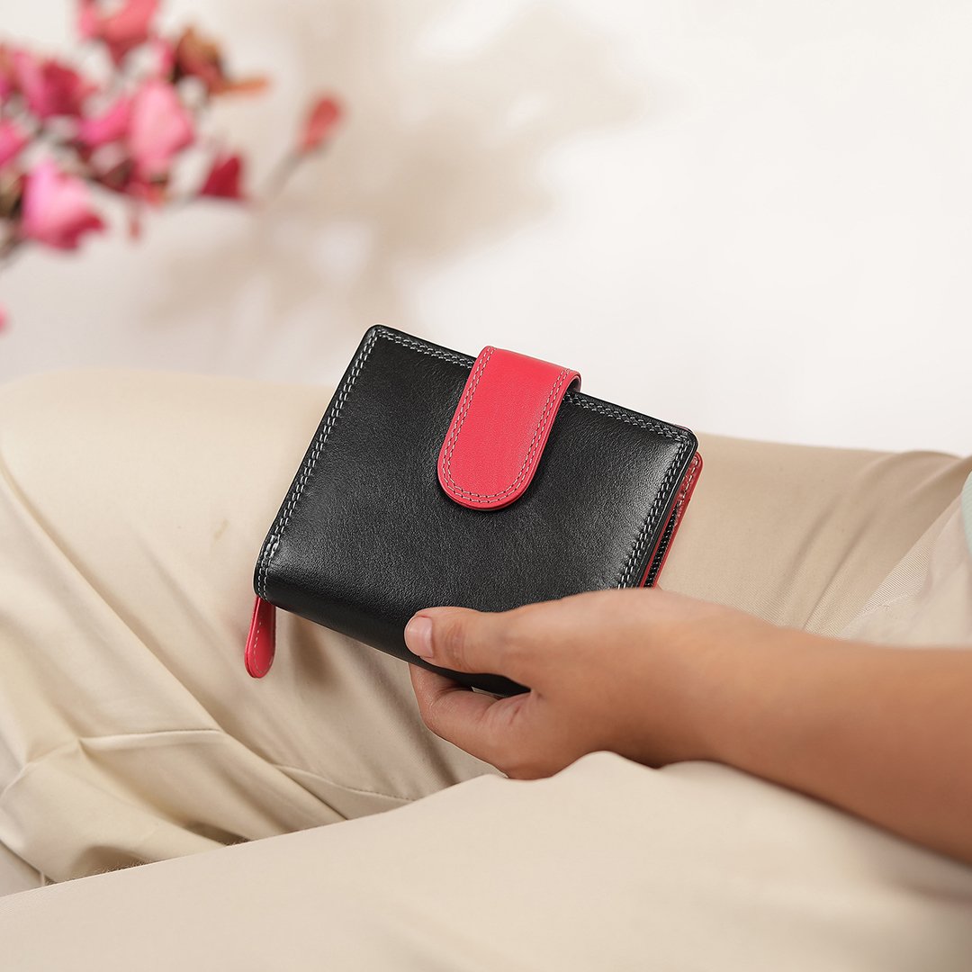 black leather purse with a pop of pink