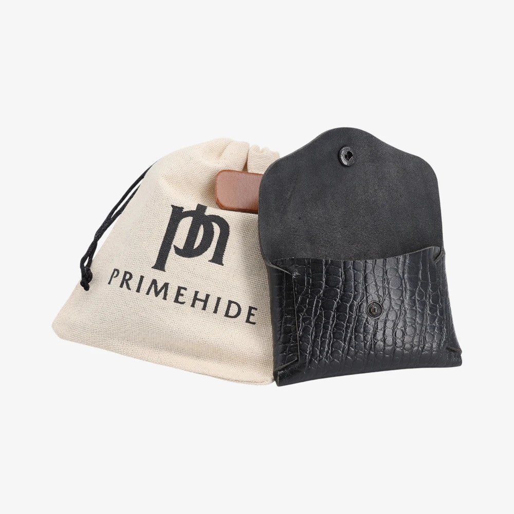 Black croc print leather coin purse opened, shown with PRIMEHIDE branded drawstring pouch