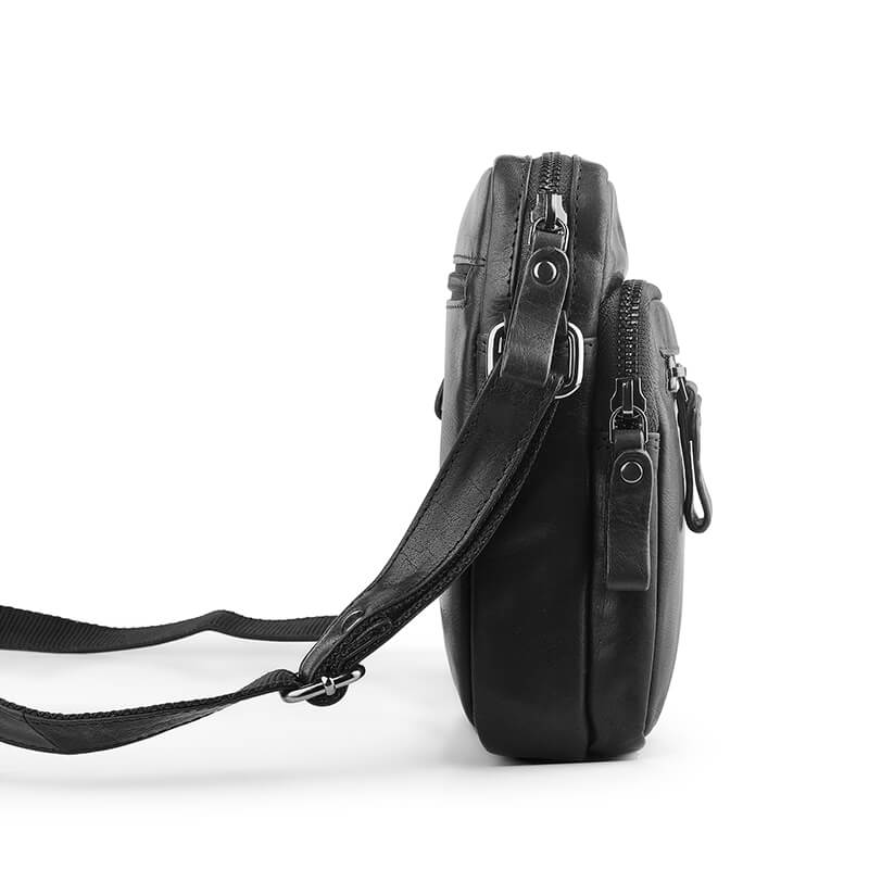 Black leather crossbody bag on a white background