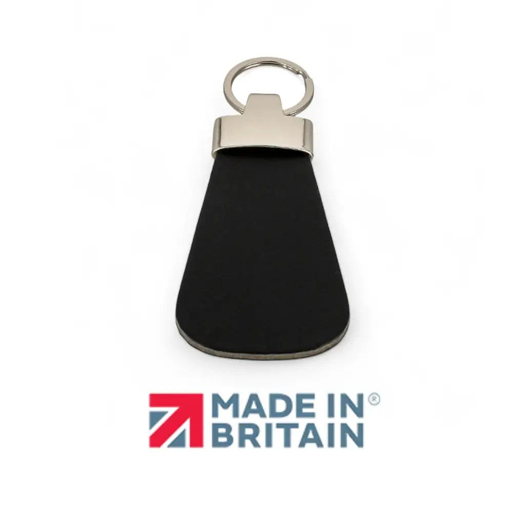 Black leather key fob with silver ring on a white background, featuring 'Made in Britain' logo.