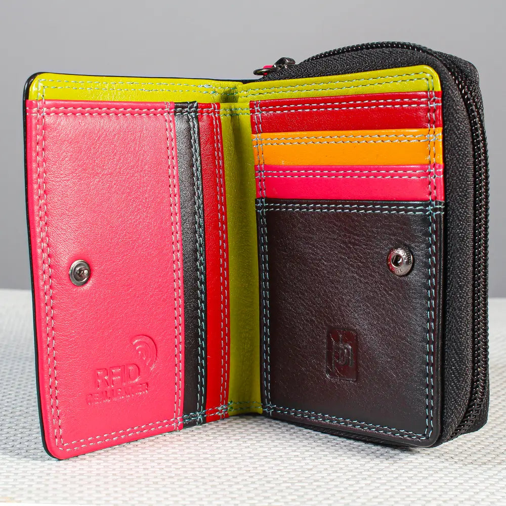 A black wallet made of textured leather, showing a bright pink interior panel, a lime green panel, and multiple colorful card slots with red, orange, and yellow stripes. 