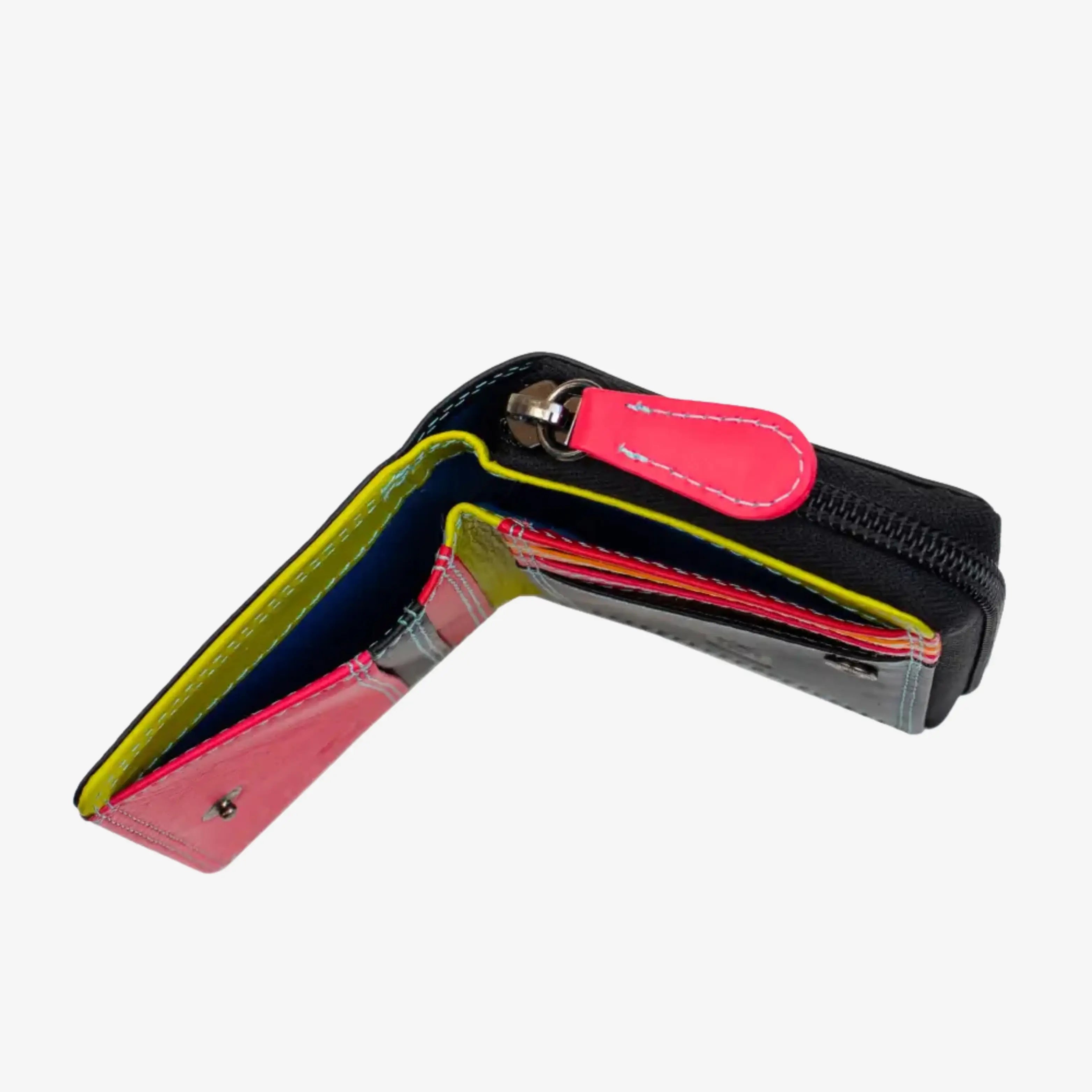 A black zippered wallet shown open, revealing a colorful interior with pink, yellow, blue, and red accents, set against a plain light gray background.