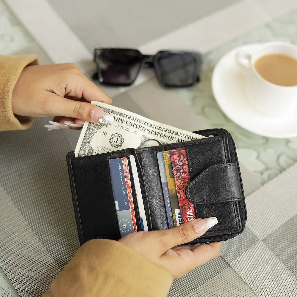 Black leather wallet with a zipper on a white background