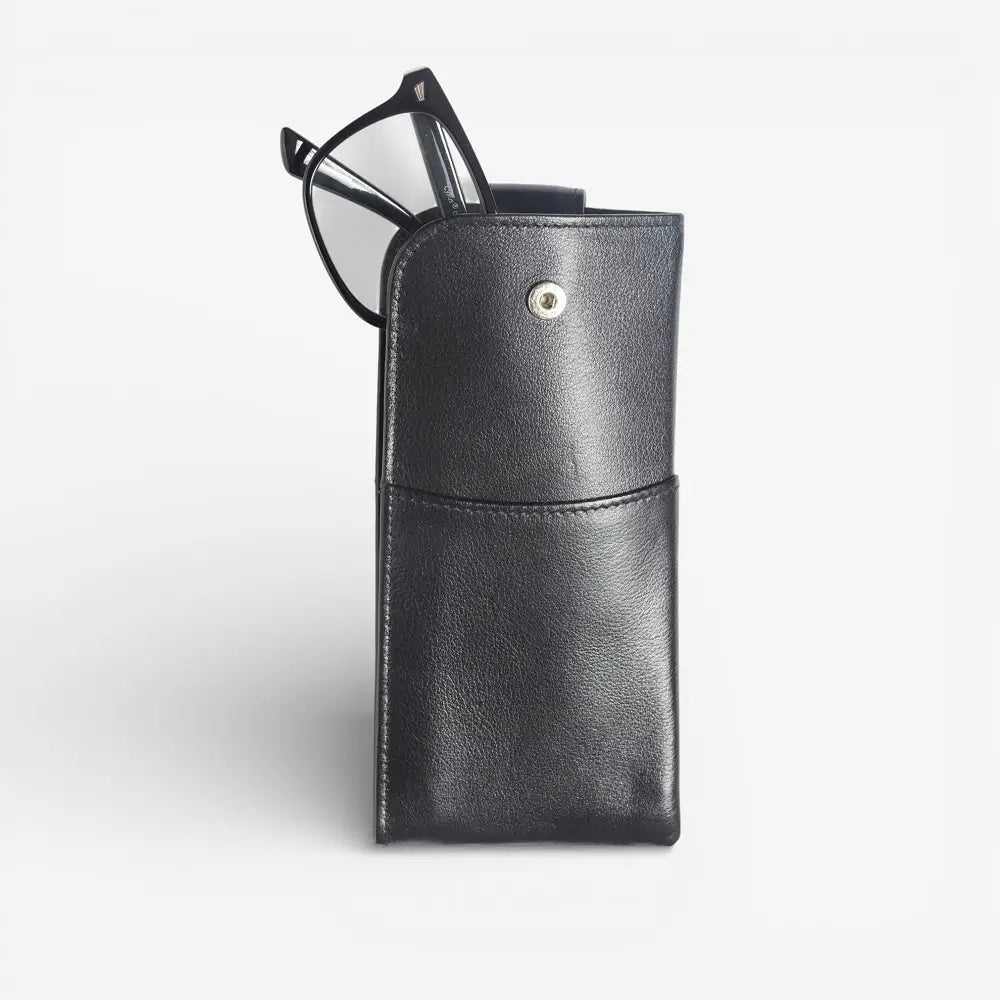 Black leather glasses case with a pair of glasses on a light gray background