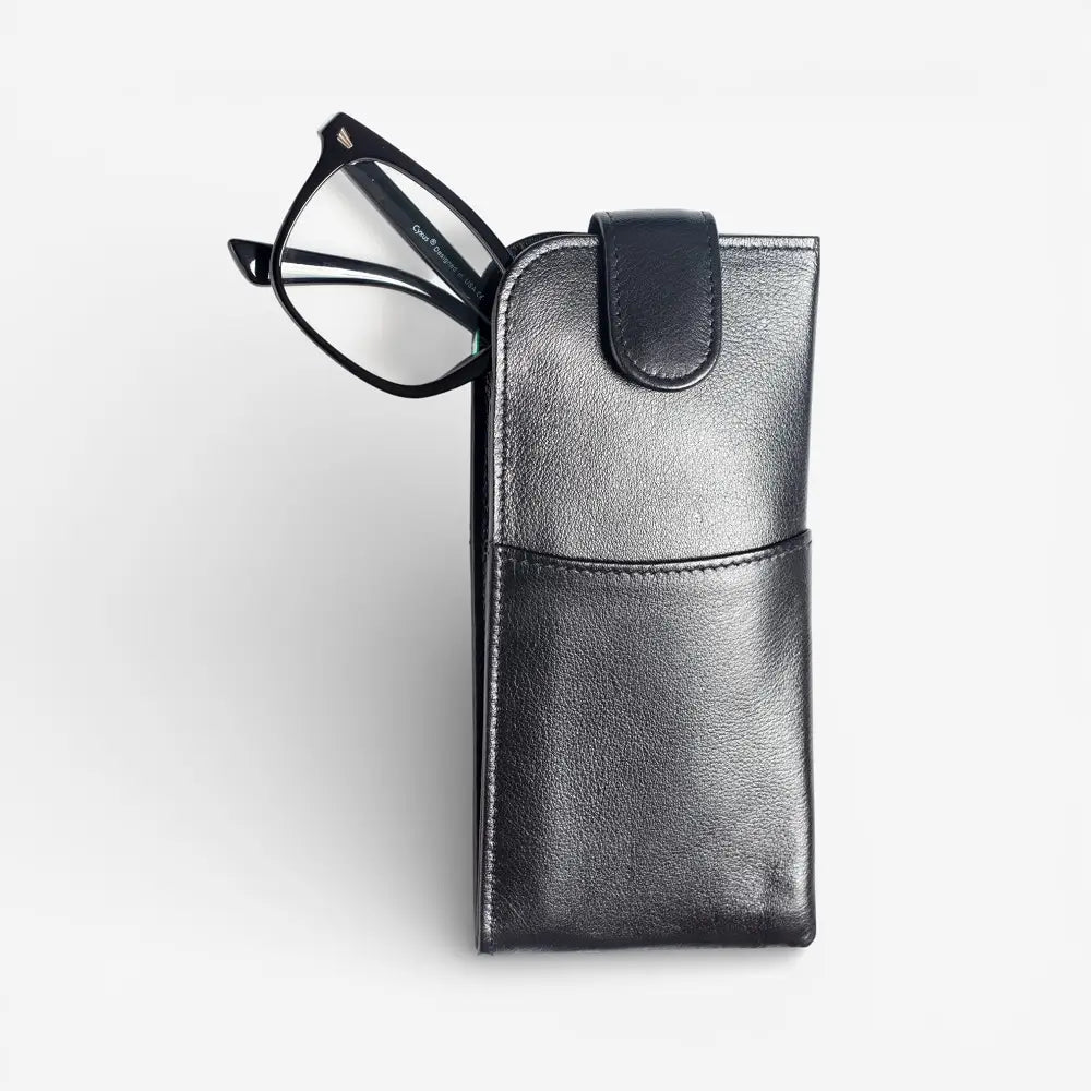 Black glasses case with a pair of glasses on a light gray background