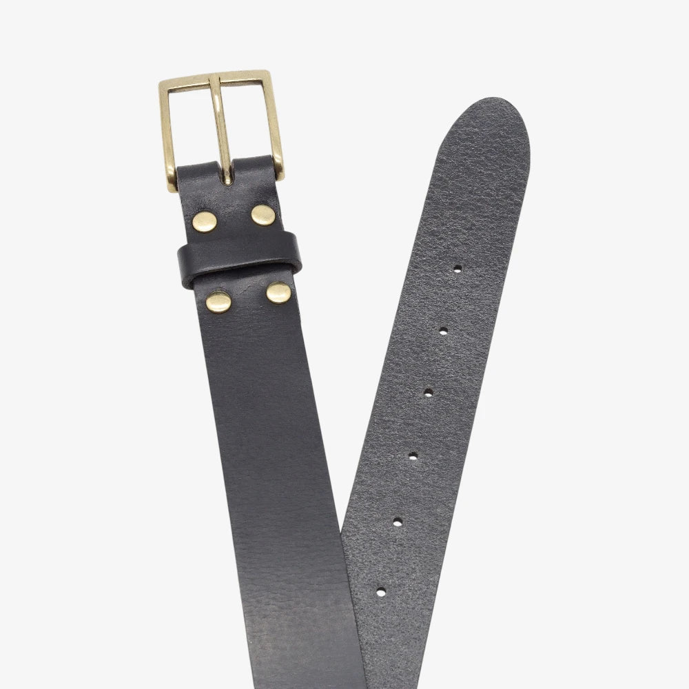 Top angle view of Black  leather belt with gold buckle on a light gray background