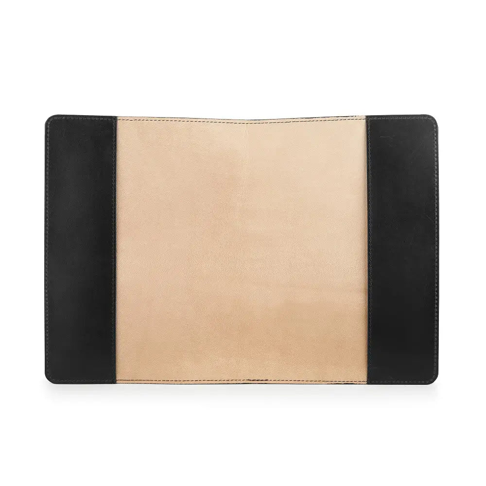 Two-tone black and beige diary cover on a white background
