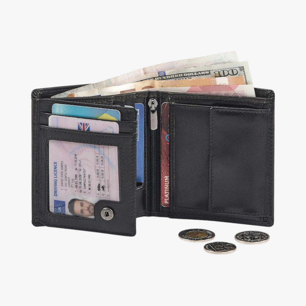 Black leather wallet with various cards, money, and coins on a white background