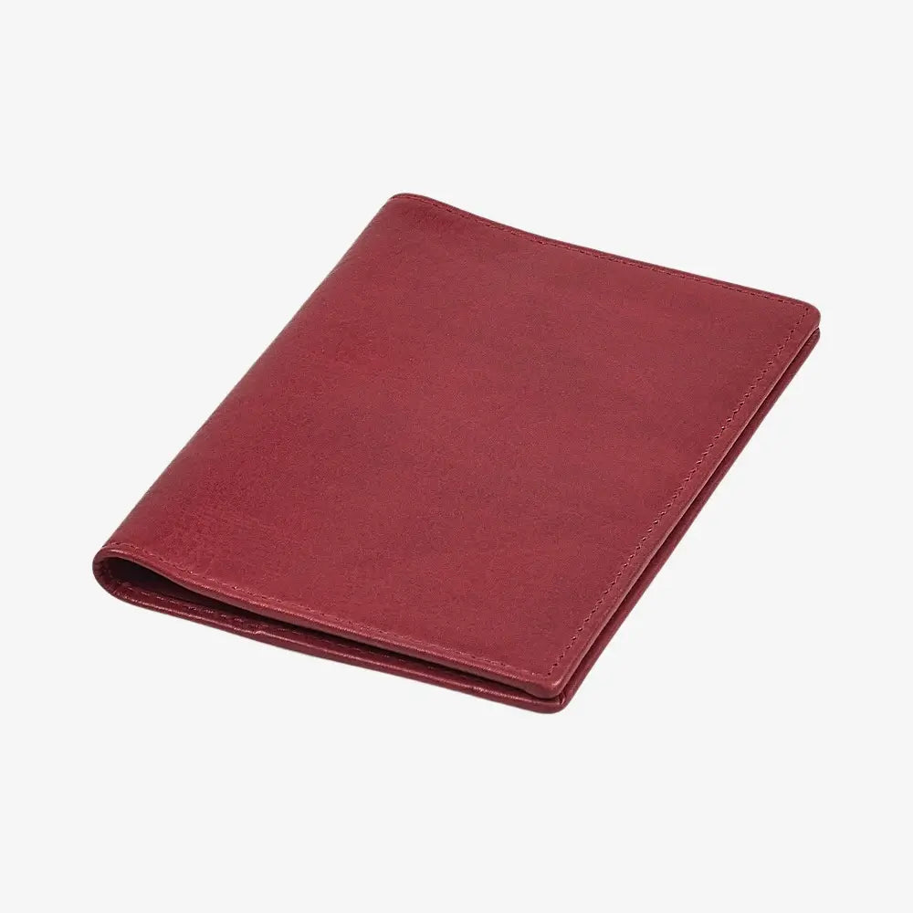 Top view of  Bordeaux leather passport holder on a white background