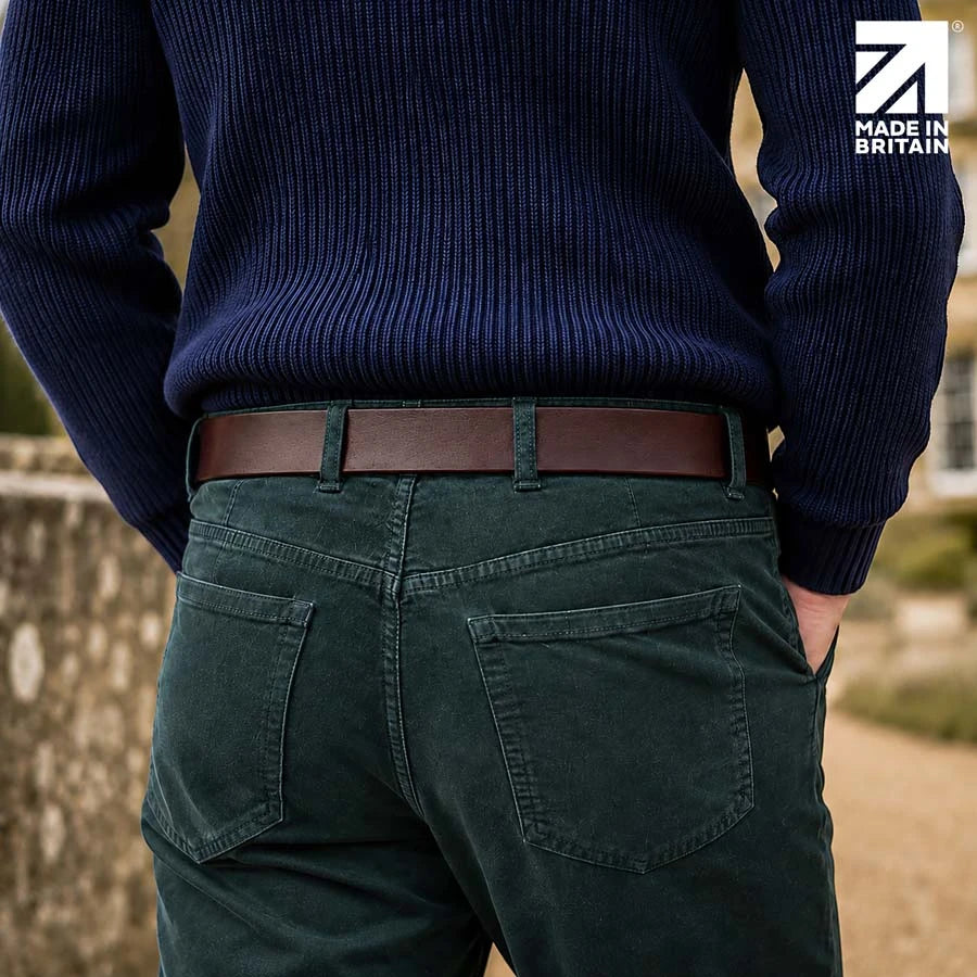 Rear view of a men’s brown leather belt worn with smart-casual trousers
