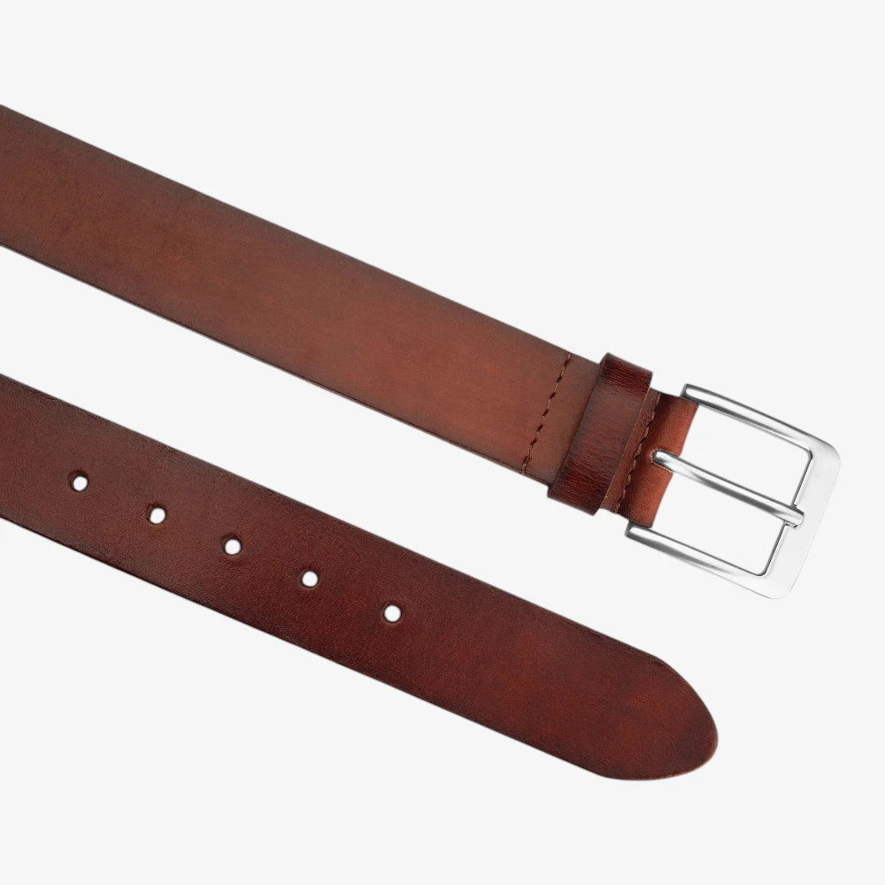 Top angle view of Brown leather belt with silver buckle on a white background