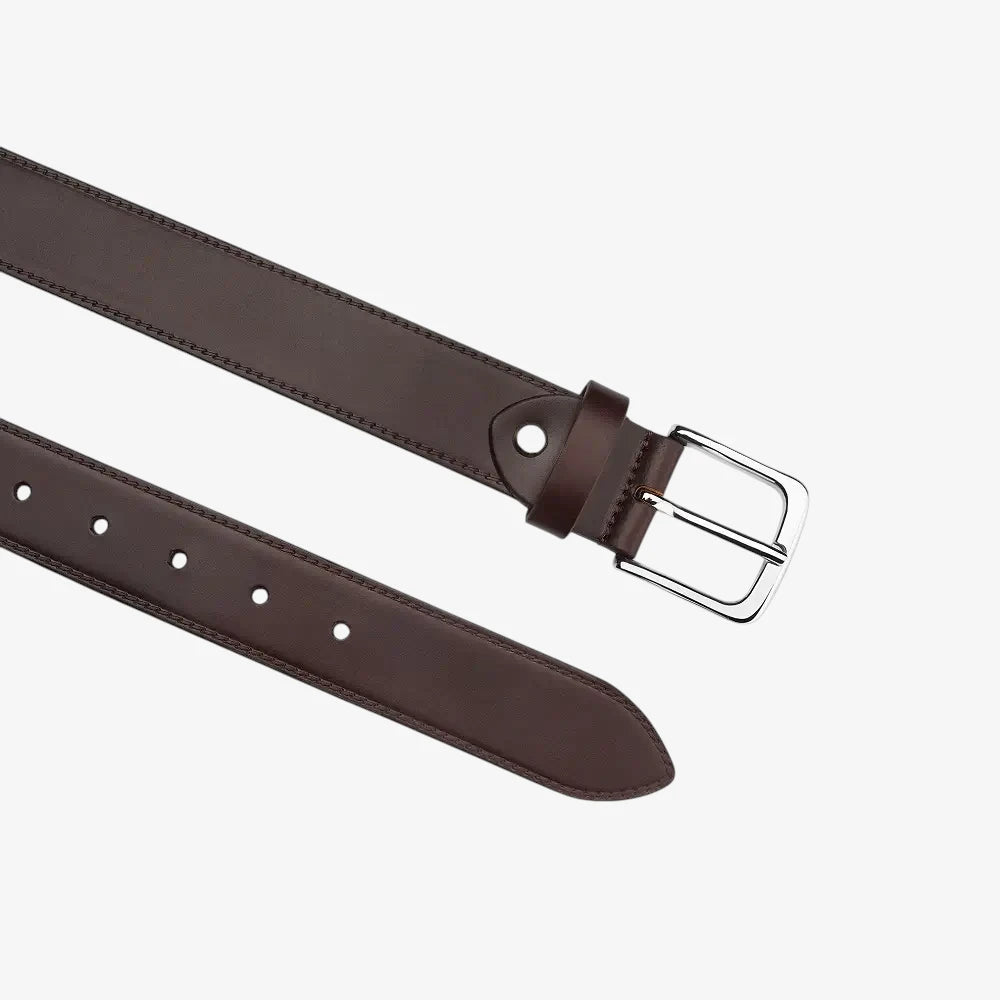 Brown leather belt with a silver buckle on a white background