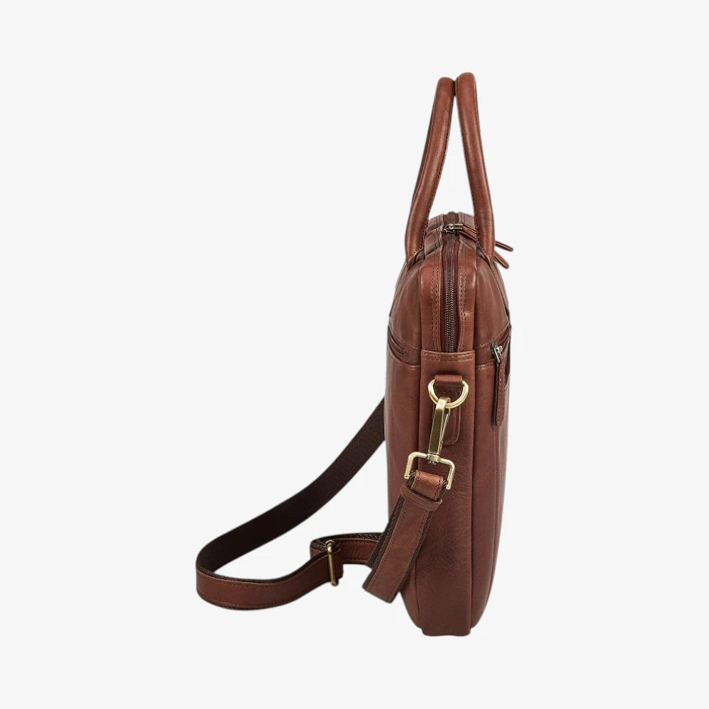 Brown leather bag with a strap on a white background