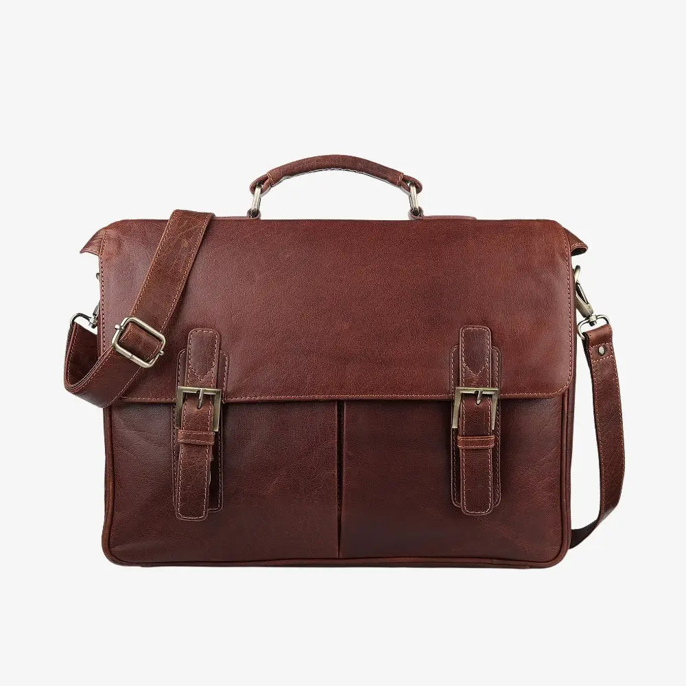 Brown leather satchel bag with shoulder strap on a white background
