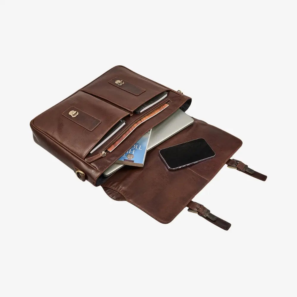 Brown leather laptop bag with compartments and a phone inside on a white background