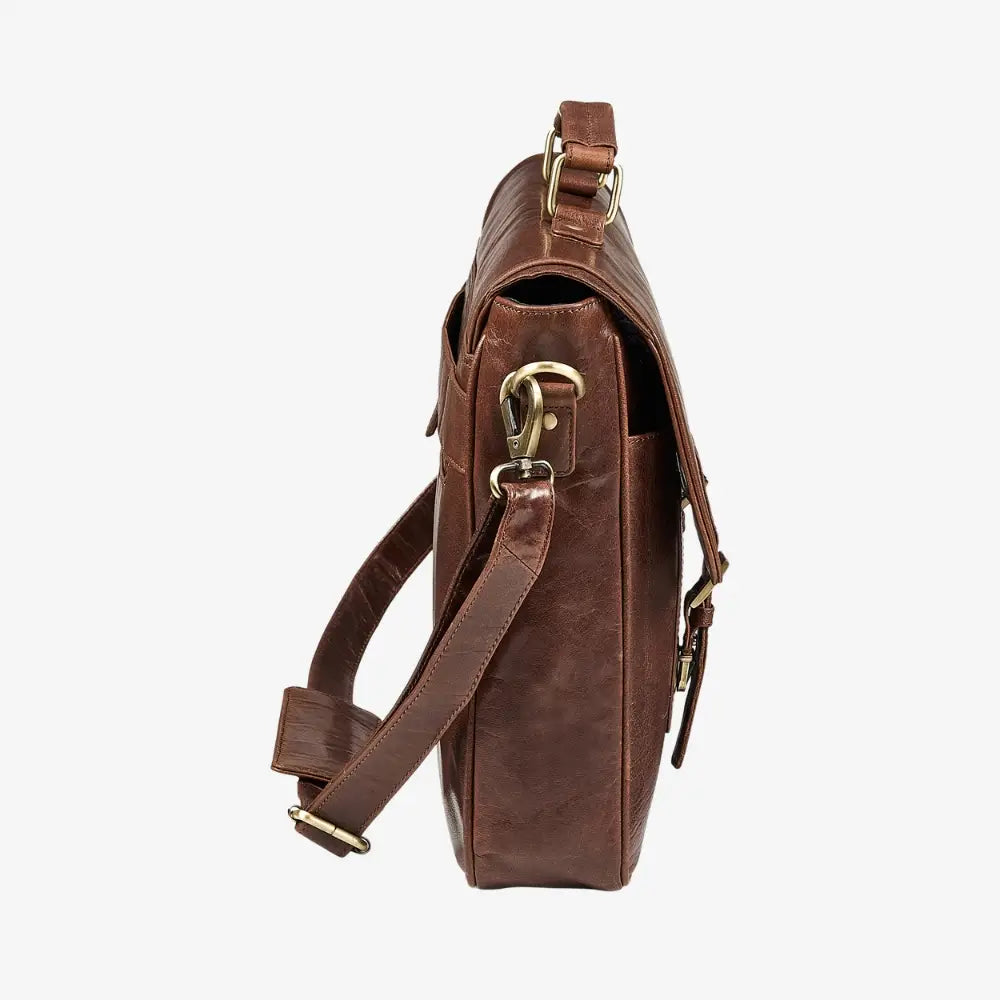 Brown leather bag with gold hardware on a white background