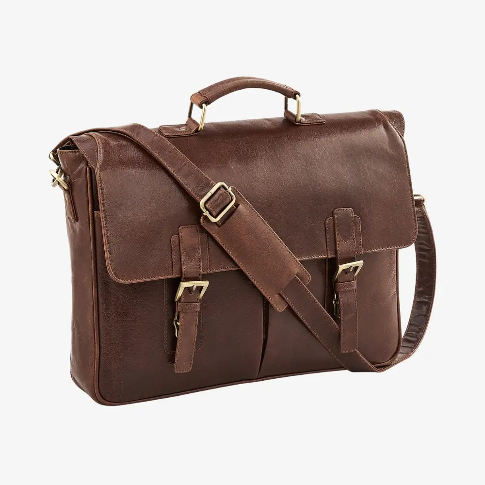 Brown leather satchel bag with gold buckles on a white background