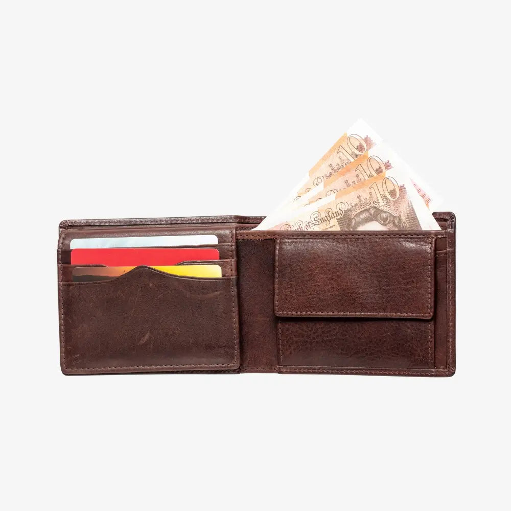 Brown leather wallet with money and cards on a white background
