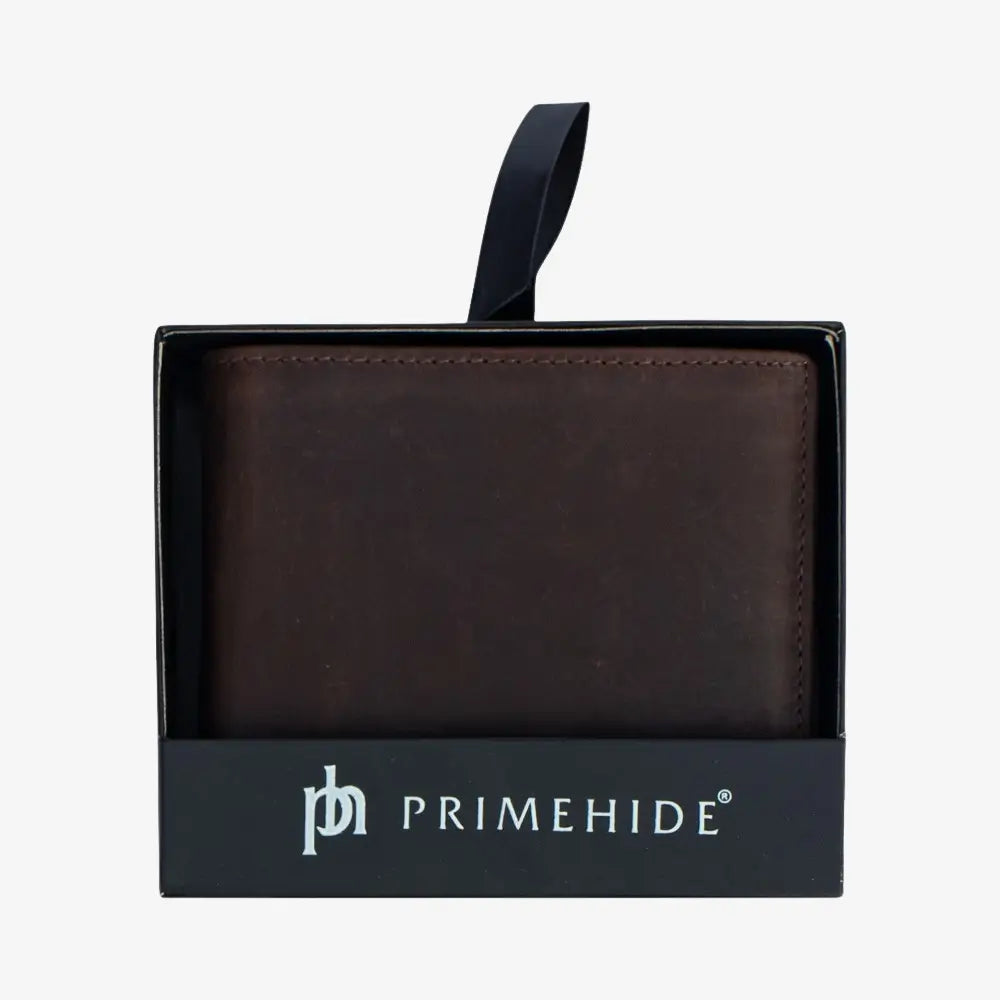 Brown leather wallet in Primehide packaging on a white background