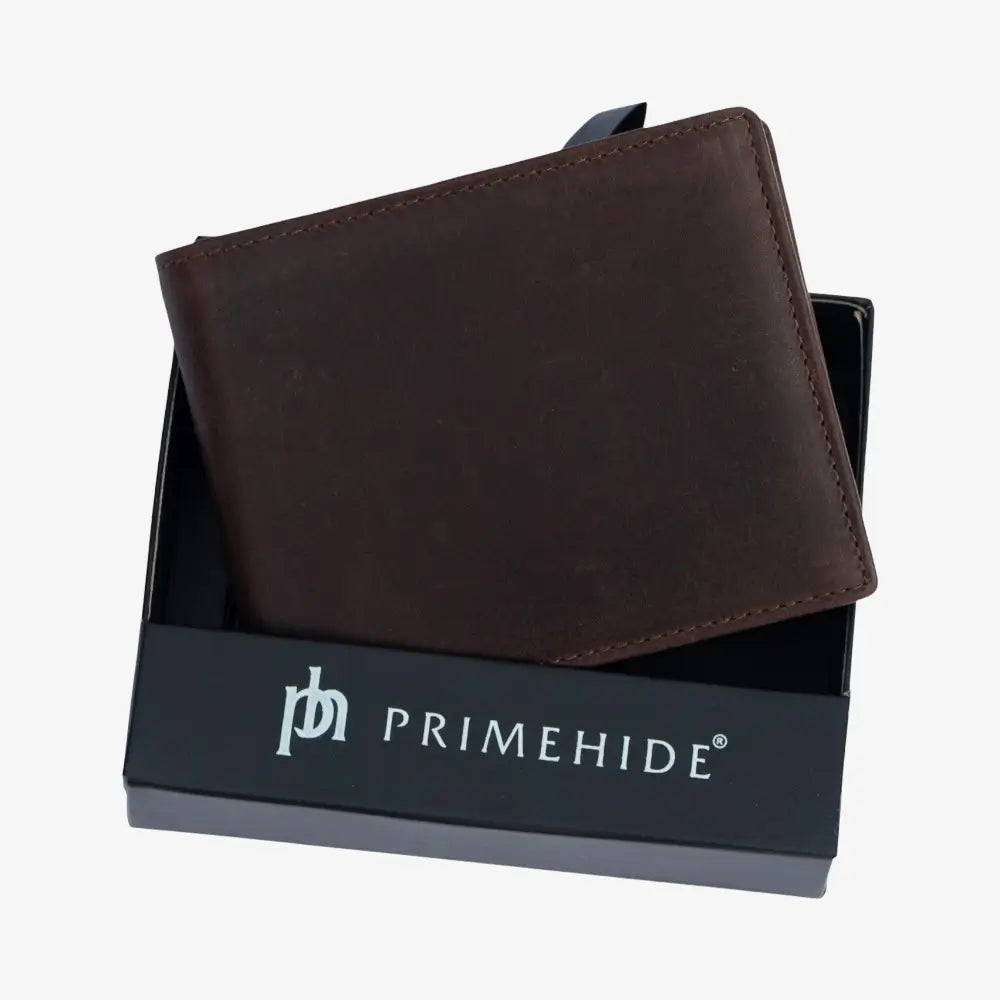 Brown leather wallet in a Primehide branded box on a white background