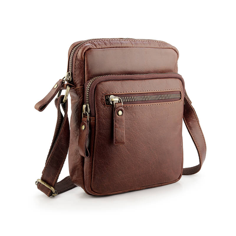 Brown leather crossbody bag with multiple pockets on a white background