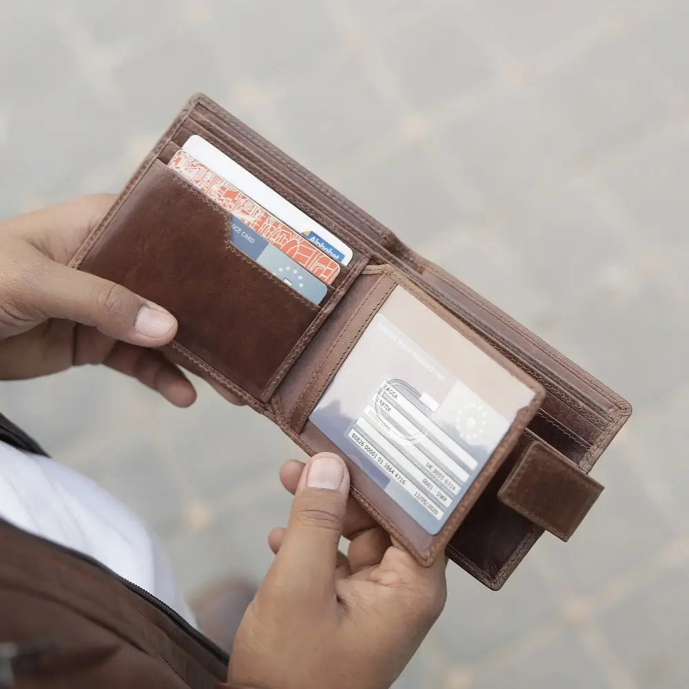 Front view of Brown leather trifold wallet on a white background