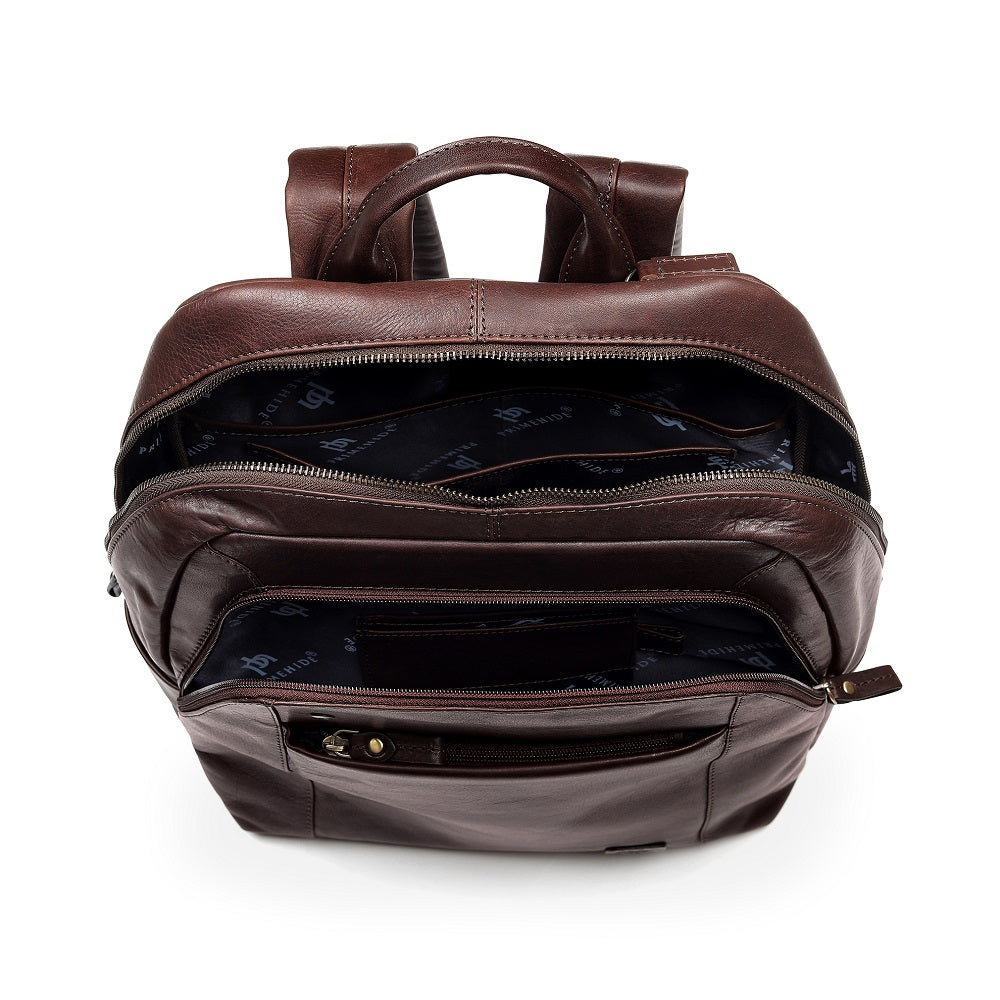 Brown leather backpack with multiple compartments on a white background